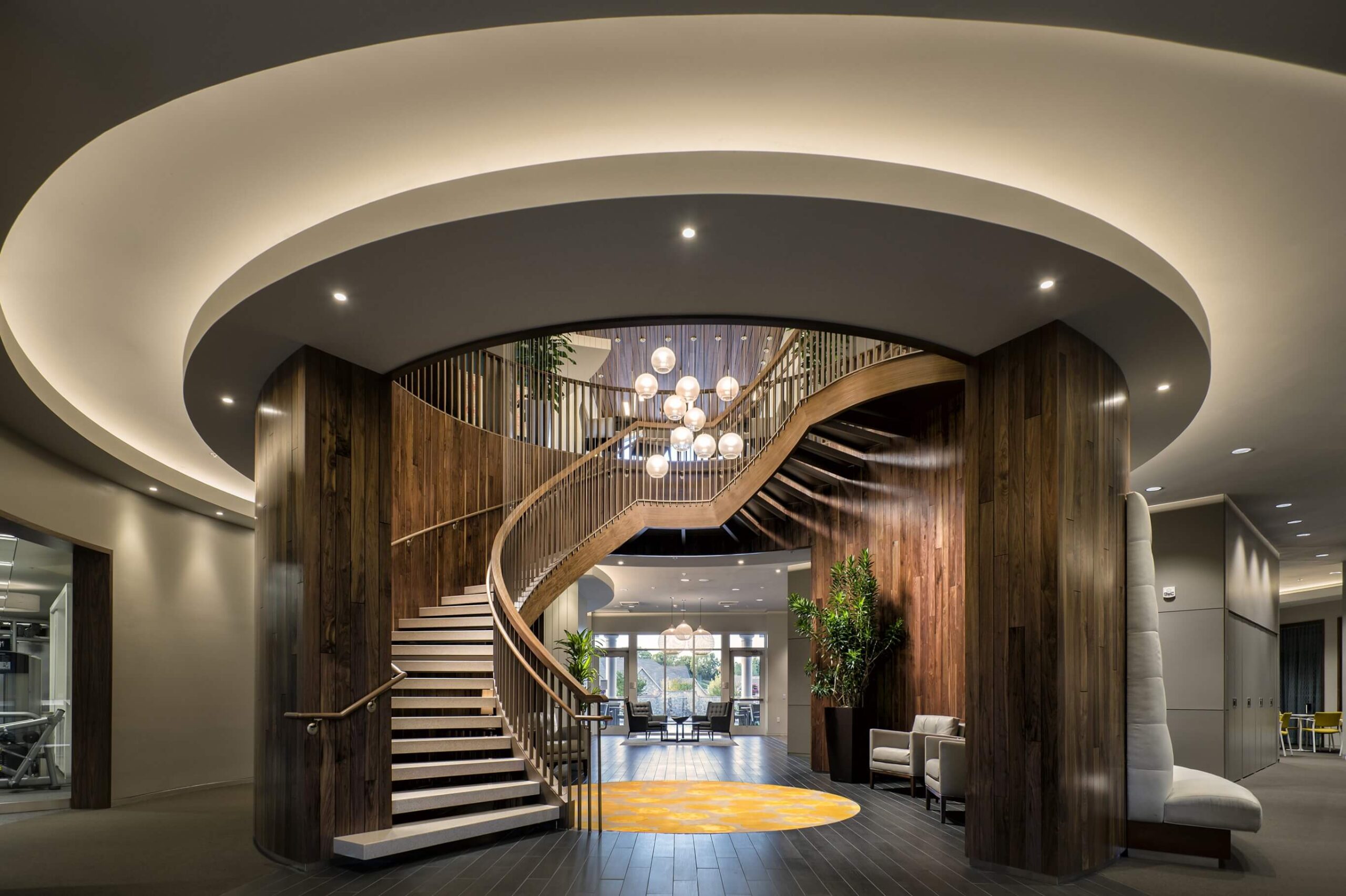 A spiral staircase in a modern office building designed for 55+ independent living.